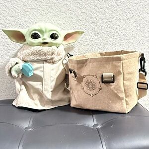 Baby Grogu Action Figure in tan tote.